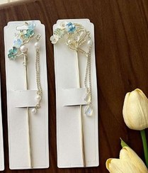 تصویر کانزاشی کره ای طرح قلب و شکوفه های آبی آویزدار 