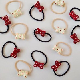 تصویر کش مو پاپیون قرمزکرم 