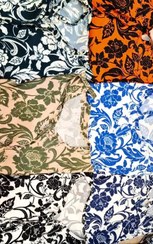 تصویر بلوز ساحلی یقه بندی و کمربند دار پامچال جنس فلور بوگاتی طرح گل 