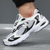 تصویر کتانی مردانه نیو بالانس مدل 725 رنگ سفید و آبی با کد 2173 