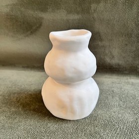 تصویر گلدان دکوری فنری دفرمه 