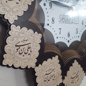 تصویر ساعت دیواری طرح مذهبی مدل تبسم 