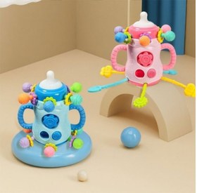 تصویر بیزی کیوب یا بیزی بال جغجغه ای دندانگیر طرح شیشه شیر فانتزی 