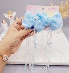 تصویر ست 2 تایی گیره مو پاپیونی پولک دار همراه با آویز نواری و نگین دار 