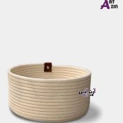 تصویر سبد سیسمونی نوزاد و جای لوسیون گرد اتاق کودک - نظم دهنده میز آرایش قیطان دوزی 10*22 سانتی - کد: 875 