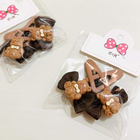 تصویر گیره تق تقی عروسکی گیره تق تقی