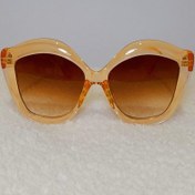 تصویر عینک آفتابی عسلی مدل قوس دار 