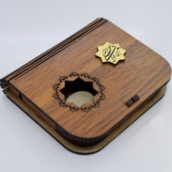 تصویر نگین سنگ حرم امام رضا علیه‌السلام متبرک با جعبه چوبی کد{10923} 