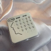 تصویر پرسینگ حلقه ای بینی طرح صلیب 