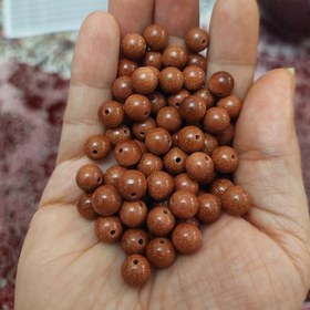 تصویر مهره سنگ دلربا قهوه ای سایز ۸ سوراخ دار 