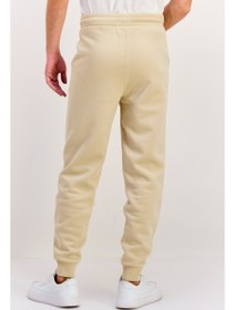 تصویر شلوار جگر مردانه با فیت معمولی و لوگوی برند، رنگ کرم برند esprit Men Regular Fit Brand Logo Jogger Pants, Cream