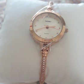 تصویر ساعت مچی زنانه برند Skmei - طلایی صفحه قرمز ا Skmei brand women's wristwatch Skmei brand women's wristwatch