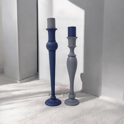 تصویر جاشمعی کنار سالنی چوبی 