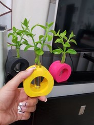 تصویر گلدان دکوری مدل دونات با لوله جای گل 