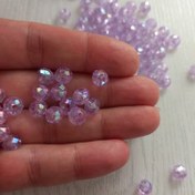 تصویر مهره کریستالی رنگ یاسی سایز 8 میل بسته 20 گرمی 