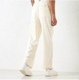 تصویر شلوار ورزشی با جزئیات مونوگرام برند استارتر برند starter Starter All-Over Monogram Detail Track Pants with Drawstring Closure and Pockets
