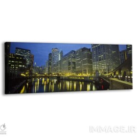 تصویر تابلو دکوراتیو Chicago River, Chicago, Illinois, USA,نمای زاویه پایین… اثر پانورامیک ایمجز - بوم گالری ایماژ / 120x40 / قاب 2x2 PVC سفید Low angle view of buildings lit up at night BY Panoramic Images