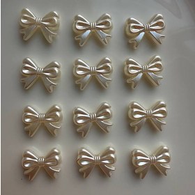 تصویر مهره پاپیون رنگ صدفی 