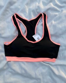 تصویر نیم تنه زنانه مدل پشت قهرمان رنگ مشکی نارنجی 