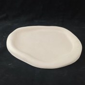 تصویر سینی سنگ مصنوعی بیضی دفرمه 