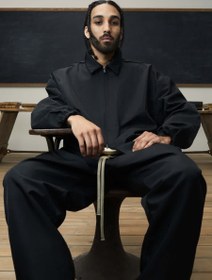 تصویر جکت Textured Nylon Trucker Jacket in Black FEAR OF GOD ESSENTIALS - سایز۱ کد 297 - 364