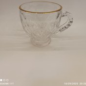 تصویر استکان شیشه‌ای دسته‌دار لبه طلایی Glass tumbler with gold rim handle