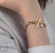 تصویر دستبند استیل کارتیر با قفل تی و مروارید 