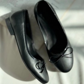 تصویر عروسکی چرمی مشکی 