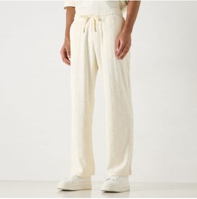 تصویر شلوار ورزشی با جزئیات مونوگرام برند استارتر برند starter Starter All-Over Monogram Detail Track Pants with Drawstring Closure and Pockets
