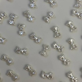 تصویر مهره پاپیون صدفی 