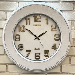تصویر ساعت دیواری ولدر Welder مدل 310، ساعت دیواری سایز 55 شماره برجسته،متریال ترکیبی چوب و پلاستیک، دارای فونت لاتین اعداد، دارای موتور آٰرامگرد درجه یک، عقربه های متفاوت، رنگ سفید 