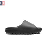 تصویر دمپایی مردانه آدیداس یزی Yeezy Slide رنگ مشکی، نارنجی و کرم با جنس پلاستیک 