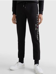 تصویر شلوار جین مردانه با لوگوی گلدوزی شده - کتان، مشکی برند Tommy Hilfiger Men's Embroidery Logo Cuffed Joggers - Cotton, Black