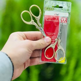 تصویر قیچی دسته طلایی 