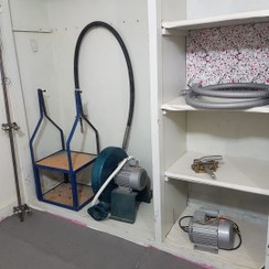 تصویر دستگاه پرداخت تخت و روگیری فرش و تابلوفرش دستبافت 