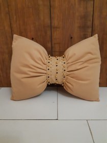 تصویر کوسن پاپیونی مرواریدی 