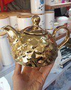 تصویر قوری چینی طلایی کف تخت 