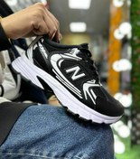 تصویر کتانی نیو بالانس مدل 303 زنانه و مردانه رنگ مشکی و طوسی با الیاف طبیعی 