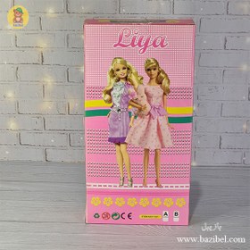 تصویر عروسک باربی با لباس اضافه 