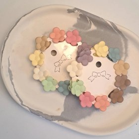 تصویر کلیپس مو طرح گل بابونه رنگی 