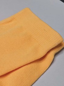 تصویر جوراب استپدار فوتبالی بلند کیفیت مستر خارجی رنگ پرتغالی 
