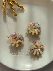 تصویر گیرسر طلایی چفتی طرح بابونه وارداتی 