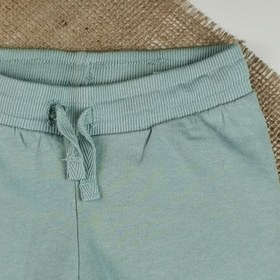 تصویر شلوار دورس نوزادی اسلش برند h&m توکرکی سبز کمرنگ رنگ - 4-6 ماه 