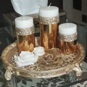 تصویر ست شمع استوانه طلایی وشمع گل رز کوچک وبزرگ وسینی جنس پلی استر طلایی 