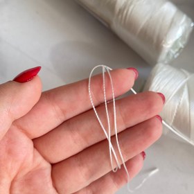 تصویر نخ ابریشمی سفید به صورت رول کامل به فروش میرسد