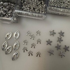 تصویر خرجکار نقره‌ای | مدل‌های ستاره دریایی، چشم و پاپیون 