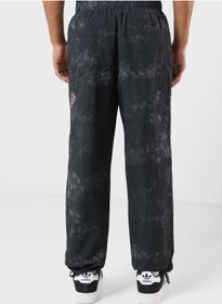 تصویر شلوار ورزشی نایلونی تریکو با طرح رنگی ذوب شده برند grimey Melted Stone Nylon Tie And Dye Track Pants