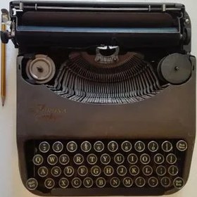 تصویر کوچکترین ماشین تایپ وتحریر فقط لاتین دنیا(کرونا) 