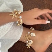 تصویر گردنبند و دستبند پر آویز 