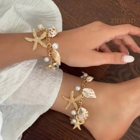 تصویر گردنبند و دستبند پر آویز 